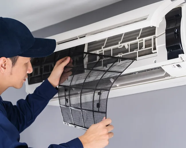 technician-service-removing-air-filter-air-conditioner-cleaning.webp